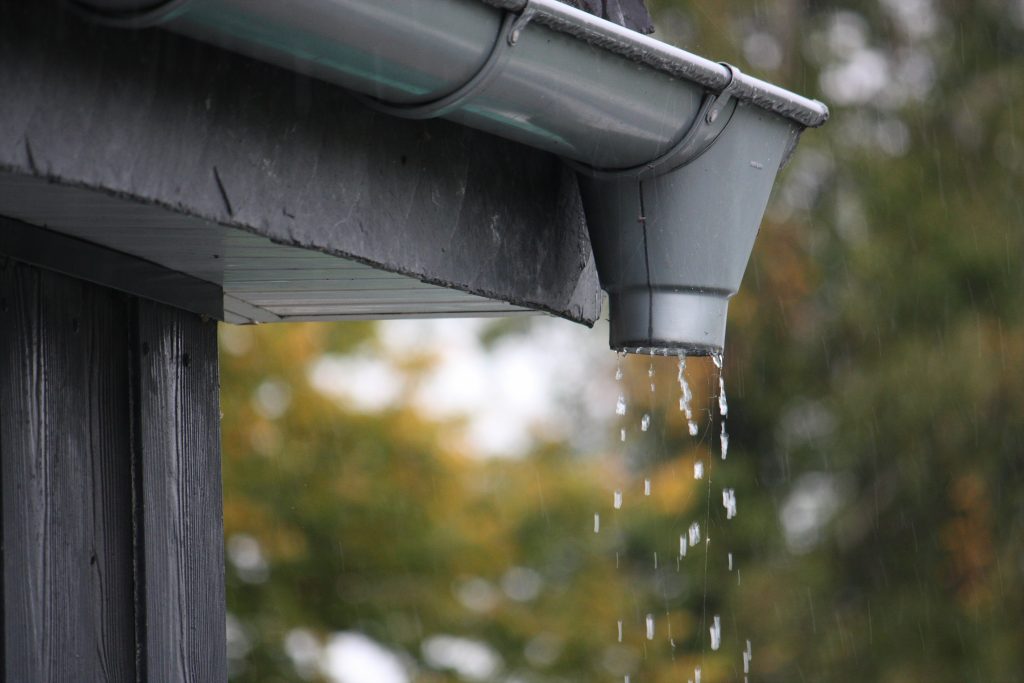 Water dripping out of a gutter spout